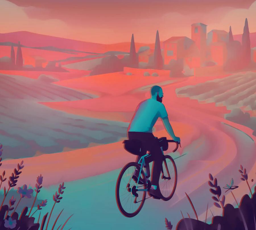Paul cycling a winding road through Provence